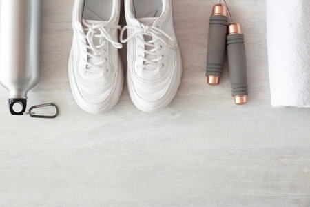 Flat lay composition with fitness equipment and space for text on gray backgroundの写真素材