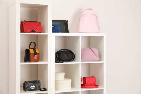 Wardrobe shelves with different stylish bags indoors. Idea for interior designの写真素材