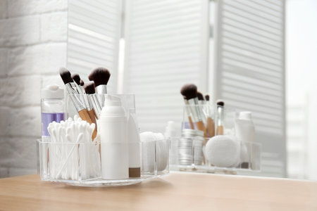 Organizer with cosmetic products and space for text on dressing tableの写真素材