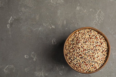 Bowl with mixed quinoa seeds and space for text on gray background, top viewの写真素材