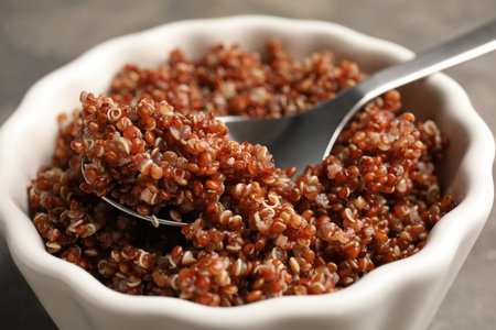 Closeup view of cooked red quinoa in bowl on tableの写真素材