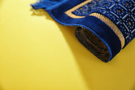 Muslim prayer rug and space for text on color backgroundの写真素材