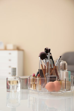 Organizer with cosmetic products for makeup on table indoorsの写真素材