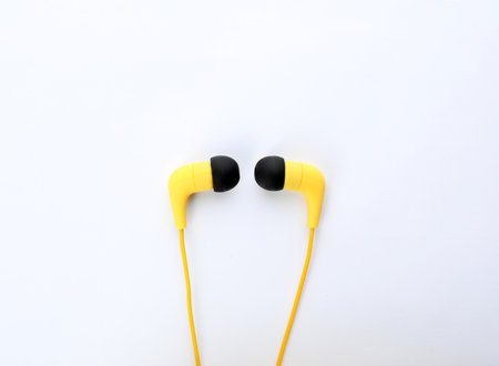 Stylish modern headphones on white background, top viewの写真素材