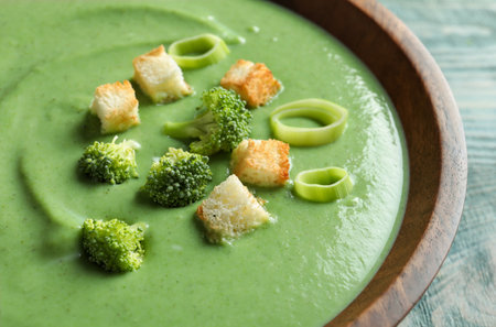 Fresh vegetable detox soup made of broccoli with croutons in dish, closeupの写真素材