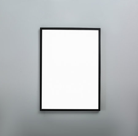 Frame with empty canvas on wall in modern art gallery. Mockup for designの写真素材