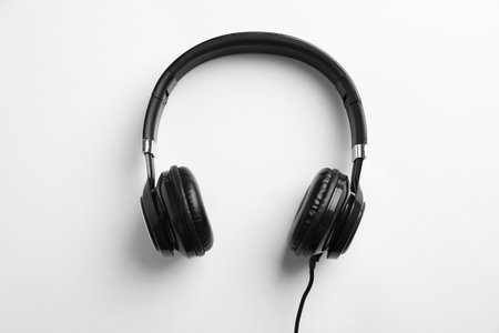 Stylish modern headphones with earmuffs on white backgroundの写真素材
