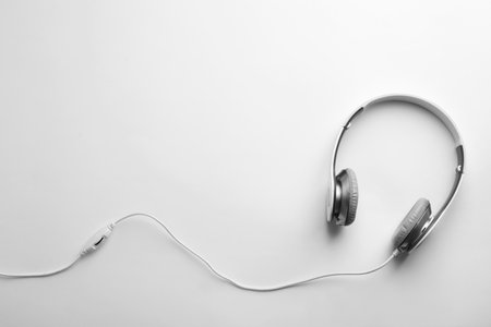 Stylish modern headphones with earmuffs on white background, top view. Space for textの写真素材