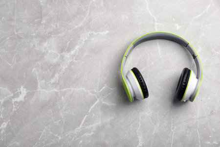 Stylish modern headphones and space for text on gray background, top viewの写真素材