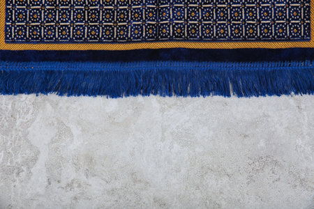 Muslim prayer rug and space for text on gray background, top viewの写真素材