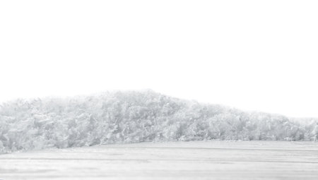 Wooden surface covered with snow against white backgroundの写真素材