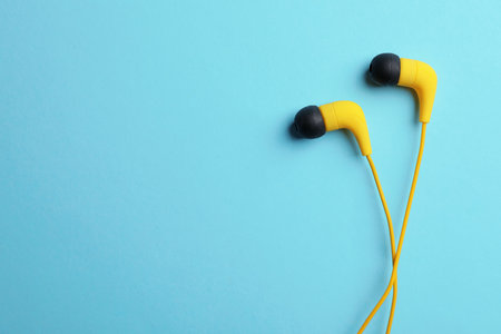 Stylish headphones on color background, top view. Space for textの写真素材