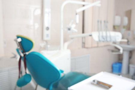 Blurred view of dentist's office with chair and professional equipmentの写真素材