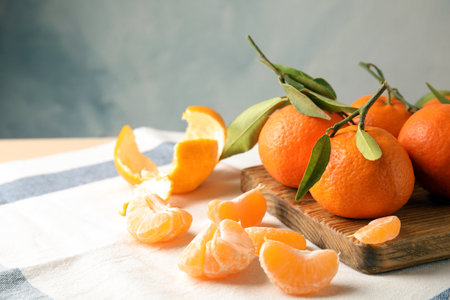 Ripe tangerines on table. Space for textの写真素材