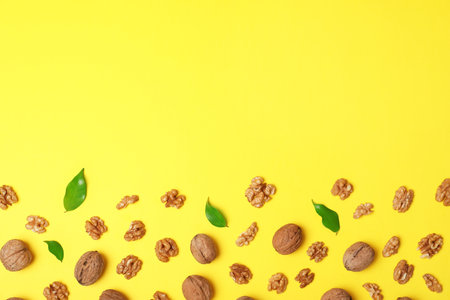 Flat lay composition with walnuts and space for text on color backgroundの写真素材