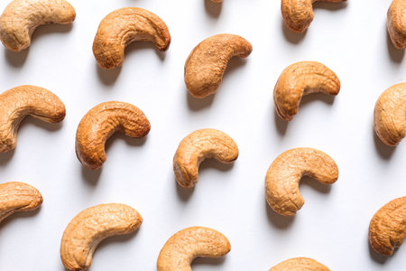 Tasty roasted cashew nuts on white background, top viewの写真素材