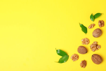 Flat lay composition with walnuts and space for text on color backgroundの写真素材