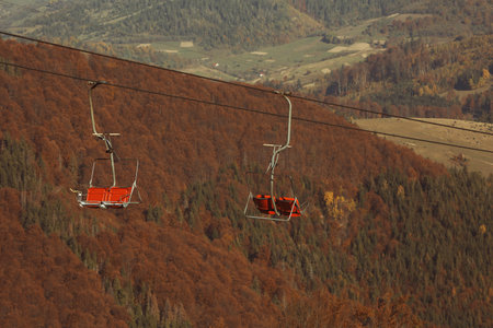 Chairlift with comfortable seats at mountain resortの写真素材