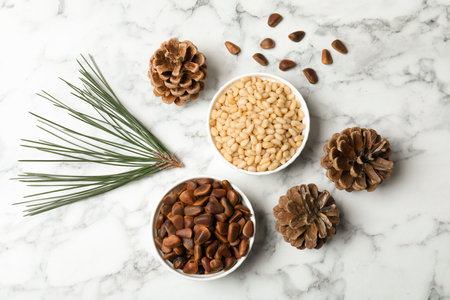 Flat lay composition with pine nuts on marble backgroundの写真素材