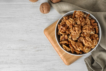 Flat lay composition with walnuts and space for text on wooden backgroundの写真素材