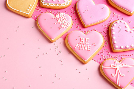 Composition with decorated heart shaped cookies and space for text on color background, top view. Valentine's day treatの写真素材