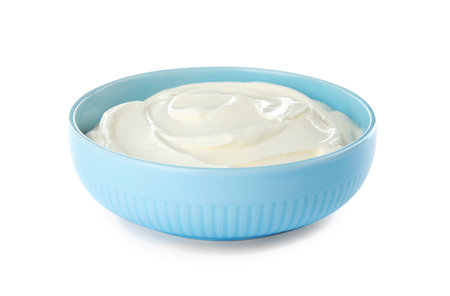 Bowl with sour cream on white backgroundの写真素材