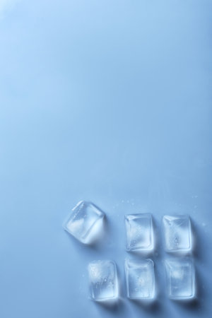 Ice cubes on color background, top view. Space for textの写真素材