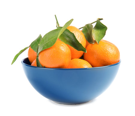 Bowl with tasty ripe tangerines on white backgroundの写真素材