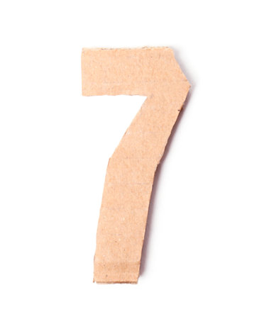 Number 7 made of brown cardboard on white background