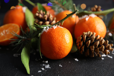 Christmas composition with ripe tangerines and artificial snow on tableの写真素材