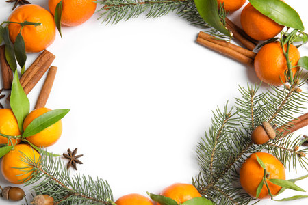 Christmas composition with ripe tangerines and space for text on white background, flat layの写真素材