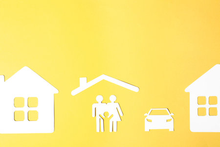 Flat lay composition with paper silhouette of family and space for text on color background. life insurance conceptの写真素材