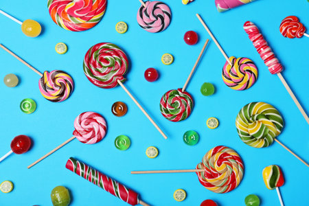 Flat lay composition with different tasty candies on color backgroundの写真素材