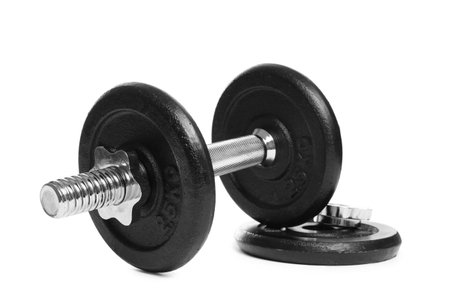 Professional dumbbell and weight plate on white background. Sports equipmentの写真素材