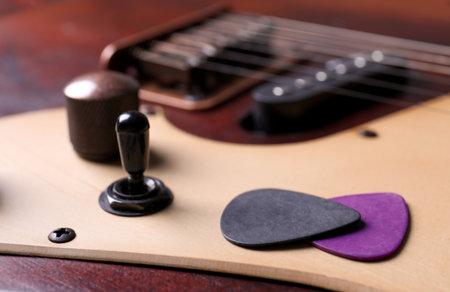 Plectrums on modern electric guitar, closeup viewの写真素材