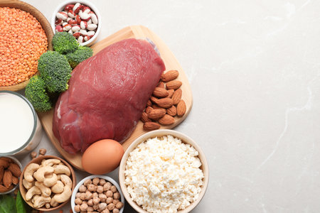 Set of natural food high in protein and space for text on light background, top viewの写真素材