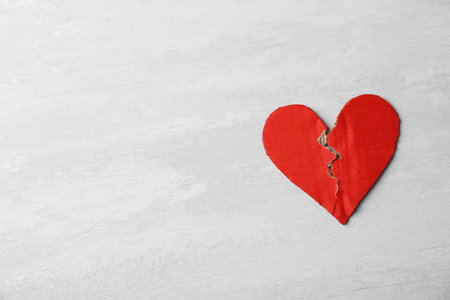 Torn cardboard heart on gray background, top view with space for text. relationship problemsの写真素材