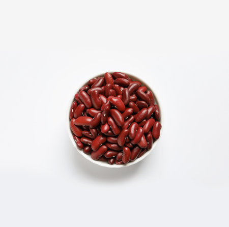 Bowl with beans on white background, top view. natural food high in proteinの写真素材