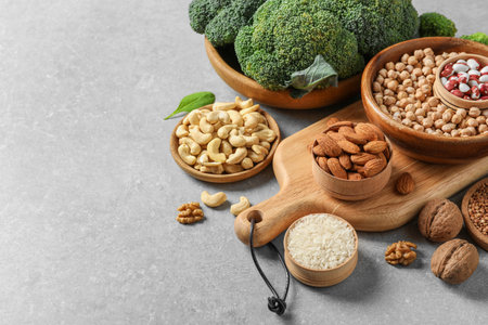 Set of natural food high in protein on gray background, space for textの写真素材