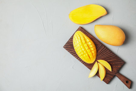 Flat lay composition with mango on gray background. Space for textの写真素材