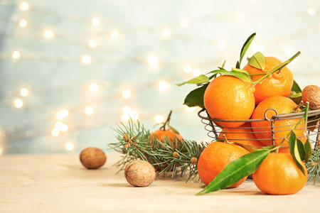 Christmas composition with ripe tangerines on table. Space for textの写真素材