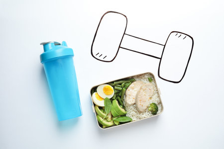 Flat lay composition with container of natural protein food on white backgroundの写真素材