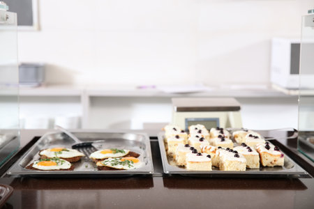 Trays with healthy food in school canteenの写真素材