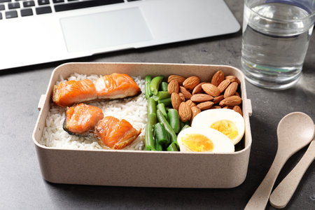 Container with natural protein food on office tableの写真素材