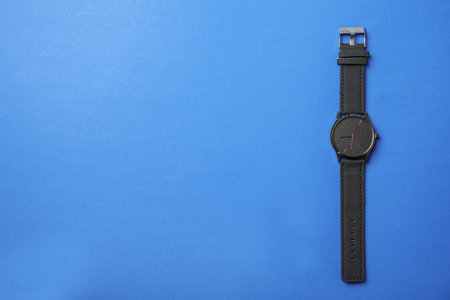 Stylish wrist watch on color background, top view with space for text. fashion accessoryの写真素材