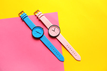 Composition with stylish wrist watches on color background, flat lay. fashion accessoryの写真素材
