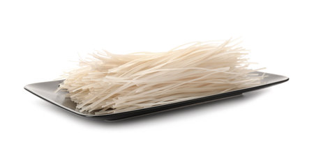 Plate with raw rice noodles on white background