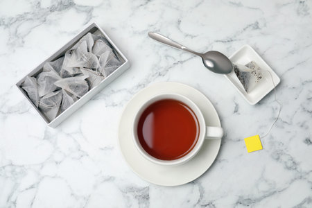Flat lay composition with delicious hot tea on marble backgroundの写真素材