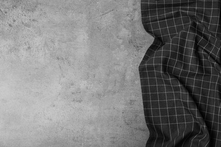 Fabric napkin and space for text on gray background, top viewの写真素材