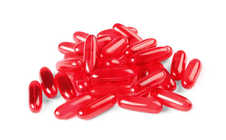 Pile of red pills on white background